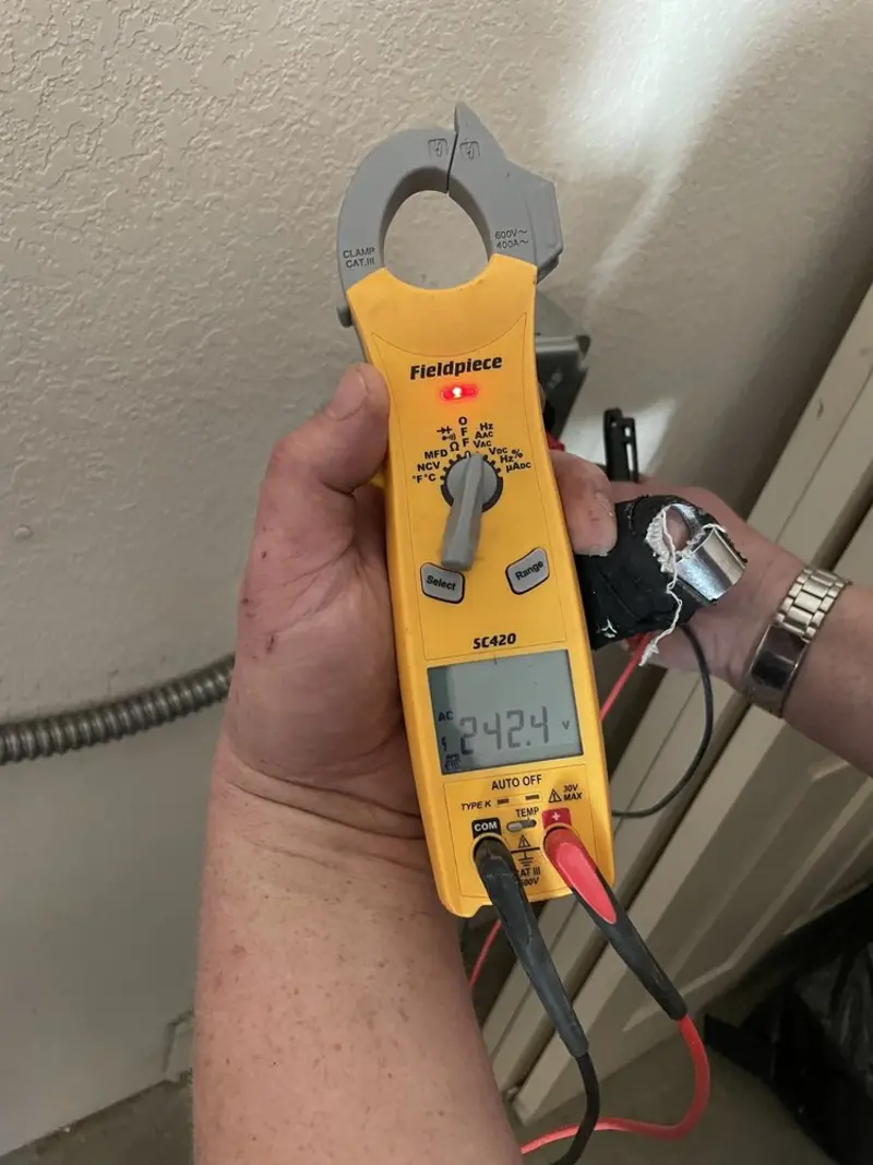 Voltage testing with clamp meter during Recessed Lighting Installation in South Euclid